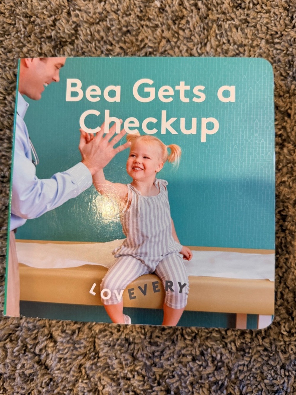 Lovevery 'Bea Gets a Checkup' Board Book - Teal Cover